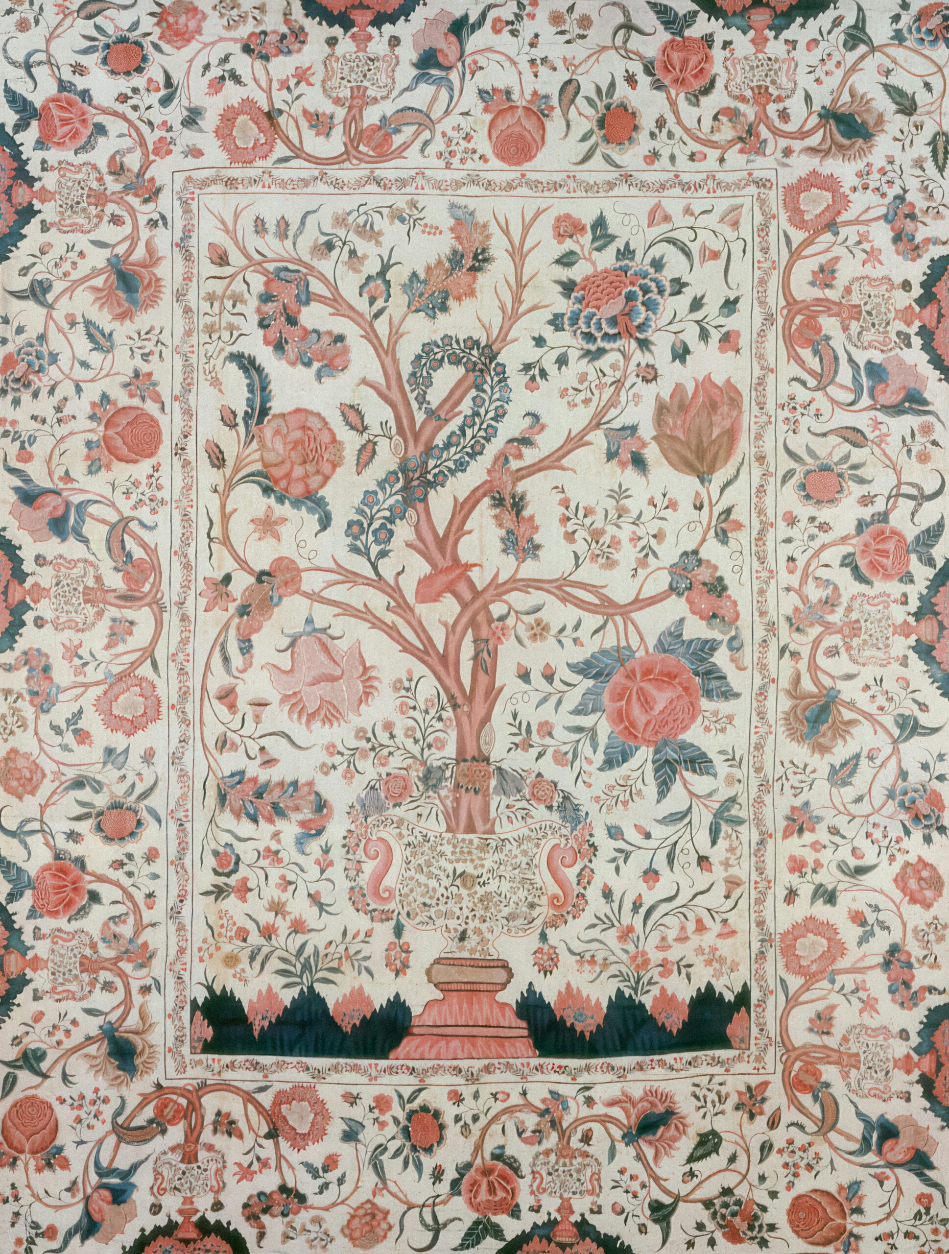 Vibrant antique Persian rug featuring tree of life motif with pomegranates, peacocks, tulips, and urn in crimson, indigo, coral, and ivory on cream ground