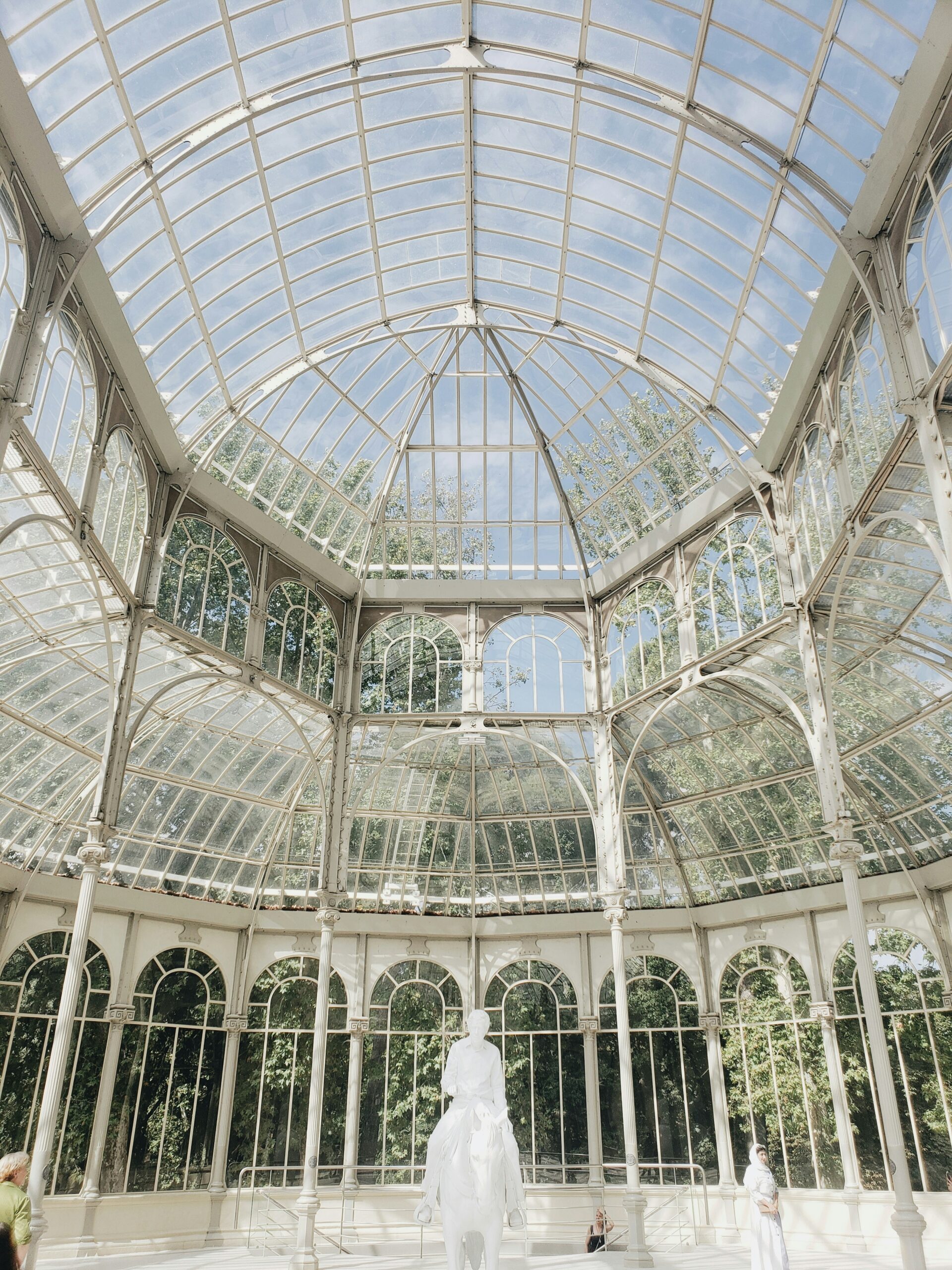 Victorian Winter Garden dome with curved iron frame and multi-pane glazing under arched ironwork