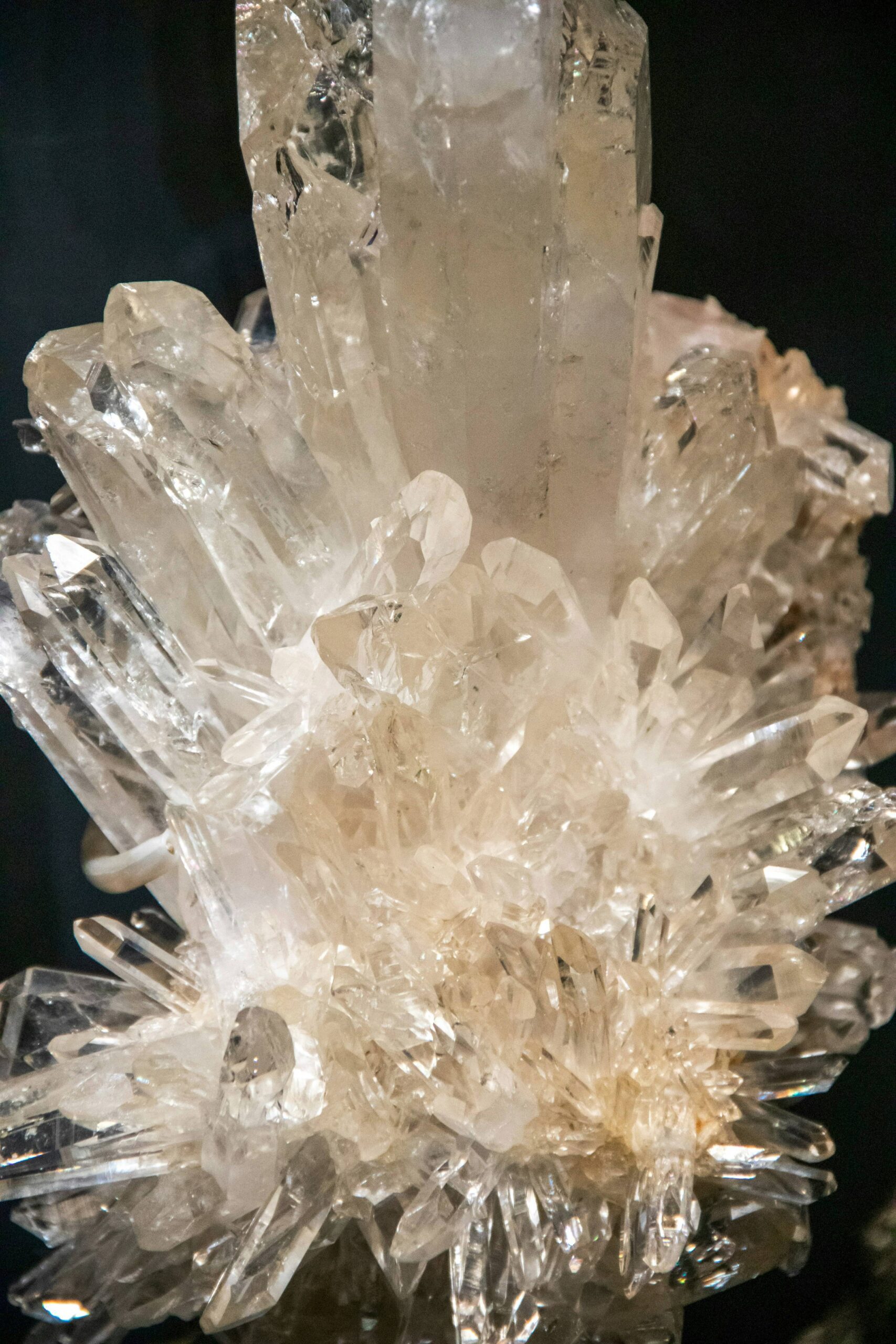 Natural rock crystal cluster with pointed quartz formations, raw material for carved rock crystal glasses